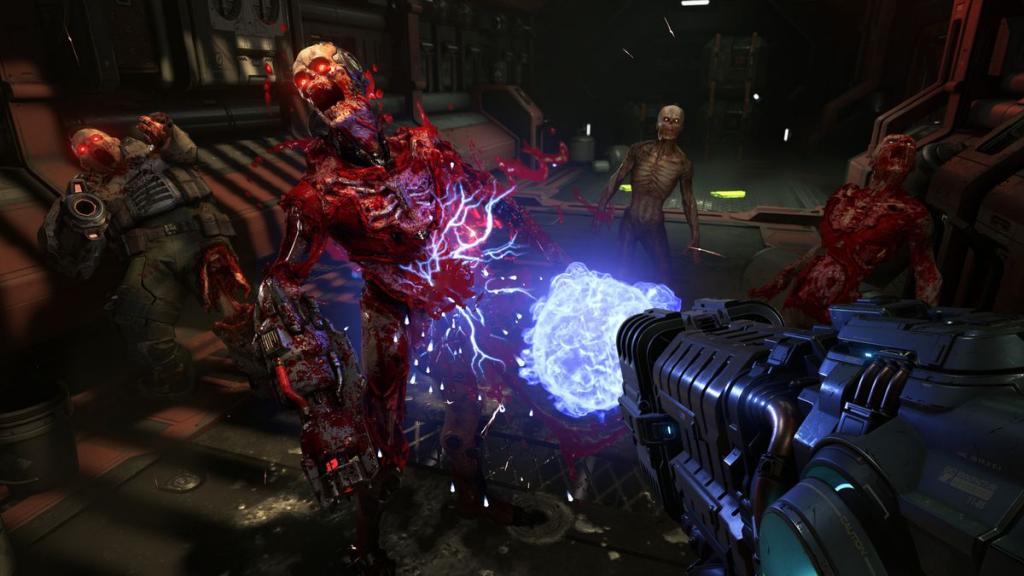 a weapon firing blue energy wipes out demons in a futuristic setting in Doom Eternal